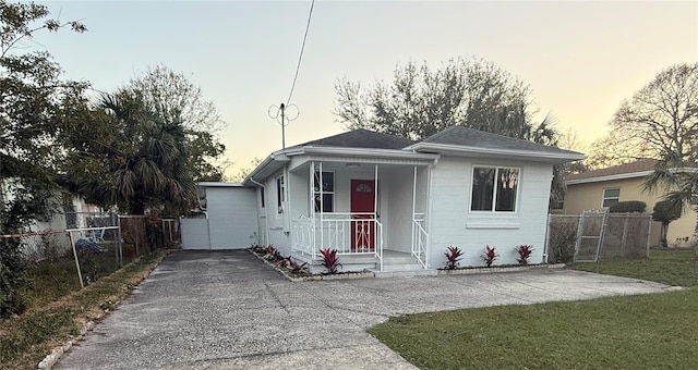 bungalow-style house with a yard