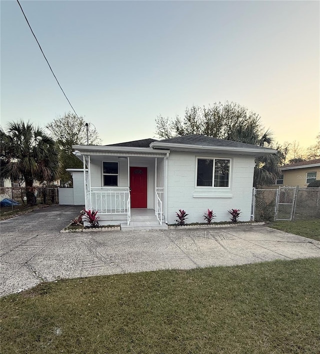 view of front of home with a yard and covered porch