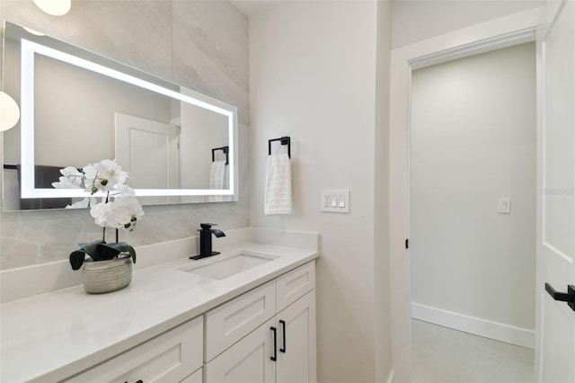 bathroom featuring tile patterned flooring and vanity