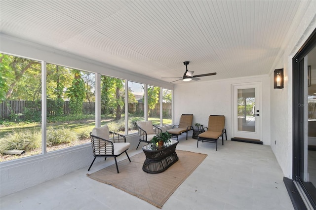 sunroom / solarium with ceiling fan