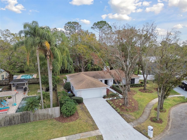 view of front of property with a front lawn and a garage