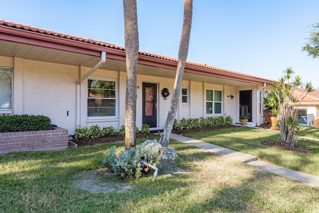 view of front of home with a porch and a front lawn