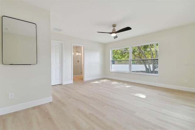 unfurnished room with light wood-type flooring and ceiling fan