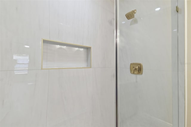 bathroom with a tile shower