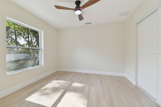 unfurnished room with light hardwood / wood-style floors and ceiling fan