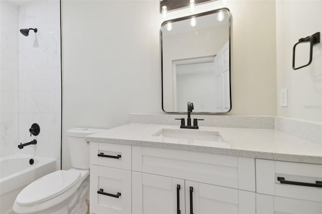 full bathroom with vanity, toilet, and tiled shower / bath combo