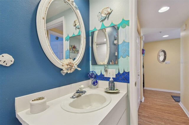 bathroom with vanity and hardwood / wood-style floors