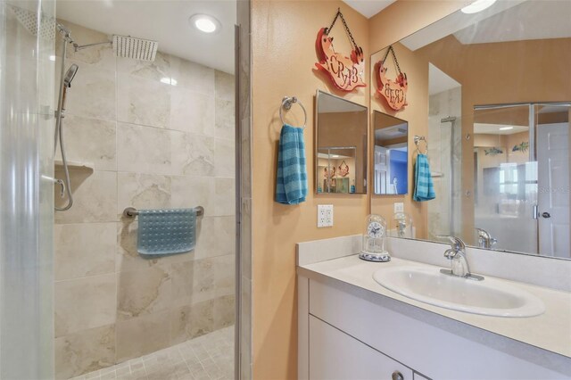 bathroom with an enclosed shower and vanity