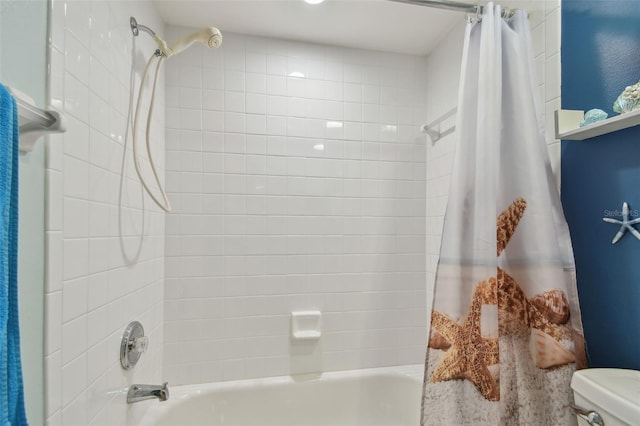 bathroom featuring toilet and shower / bathtub combination with curtain