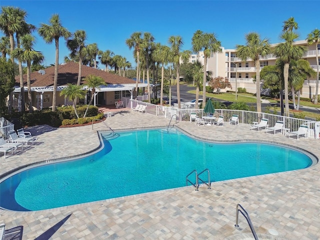 view of swimming pool with a patio area