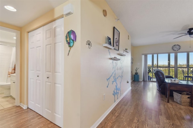 hall with hardwood / wood-style floors