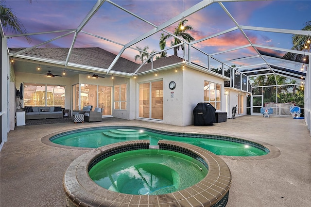 pool at dusk featuring ceiling fan, an outdoor living space, grilling area, an in ground hot tub, and a patio