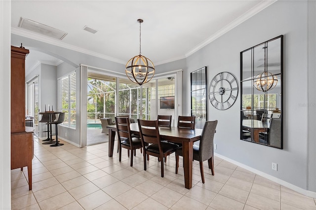 tiled dining space with an inviting chandelier and crown molding