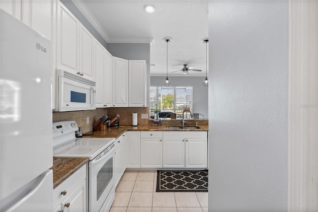 kitchen featuring white cabinets, decorative light fixtures, white appliances, and sink