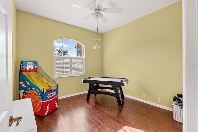 recreation room with ceiling fan and dark hardwood / wood-style floors