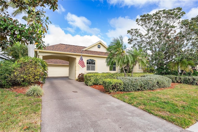 view of front facade with a garage and a front yard