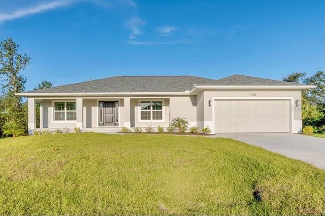 view of front of home featuring a porch, a garage, and a front lawn