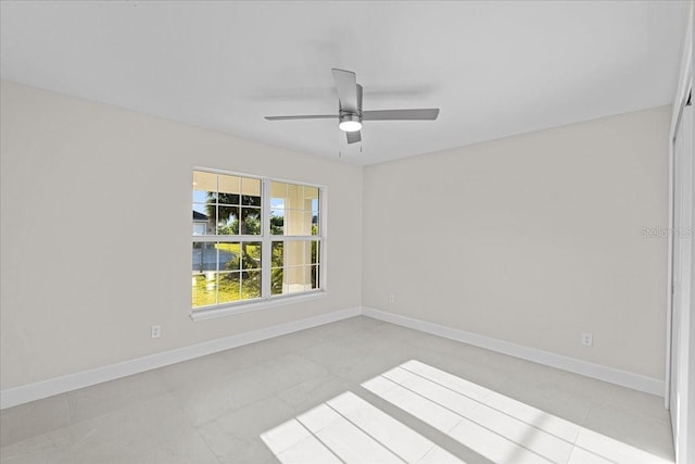 spare room with ceiling fan