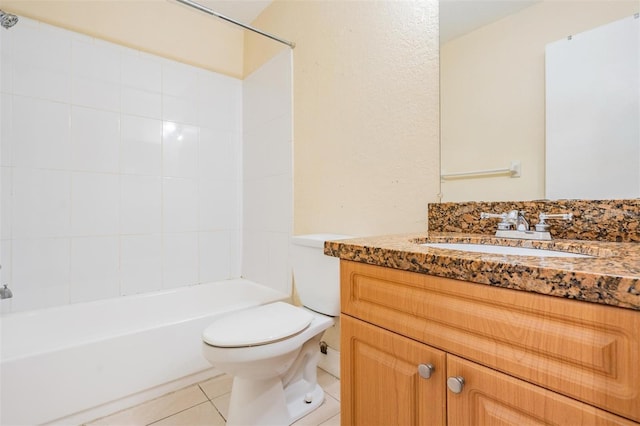 full bathroom featuring tile patterned floors, bathing tub / shower combination, vanity, and toilet