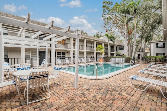 view of pool featuring a pergola and a patio