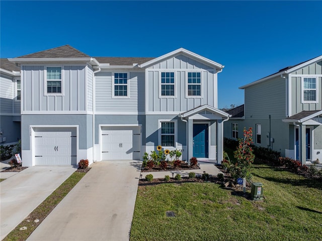 view of front of house featuring a front yard and a garage