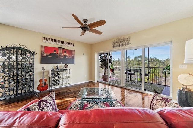 living room with ceiling fan and wood-type flooring