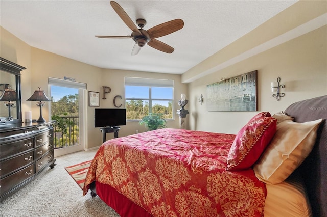 carpeted bedroom with access to outside and ceiling fan