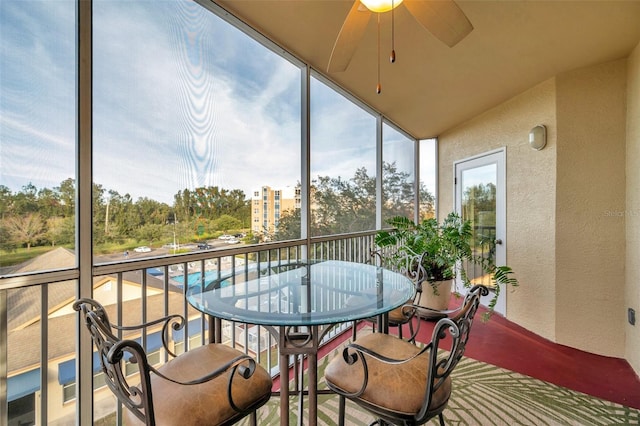 sunroom / solarium with ceiling fan