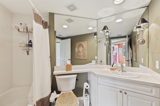 full bathroom featuring vanity, shower / bath combo, and toilet