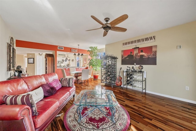 living room with hardwood / wood-style flooring and ceiling fan