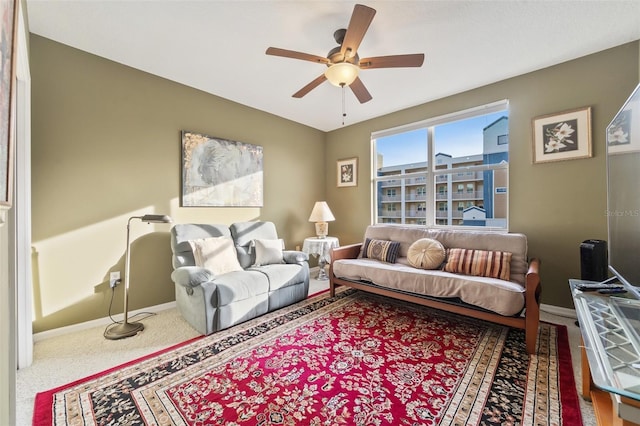 living room with carpet flooring and ceiling fan