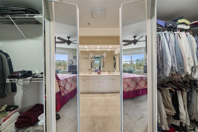 bathroom featuring ceiling fan, tile patterned flooring, and vanity