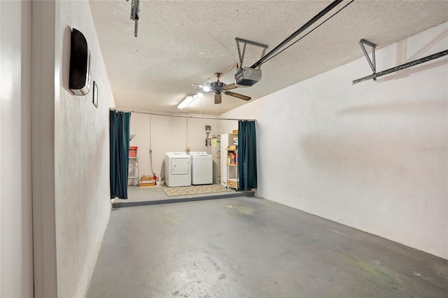 garage with a garage door opener, ceiling fan, and separate washer and dryer