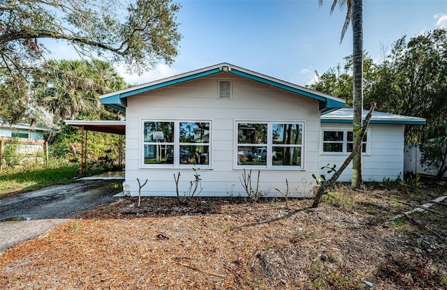 exterior space with a carport