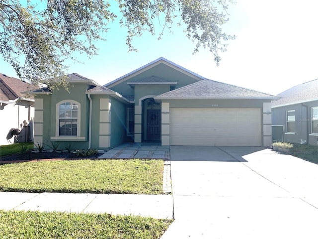 8408 Canterbury Lake Blvd, Tampa, FL 33619 - single story home with a garage and a front yard