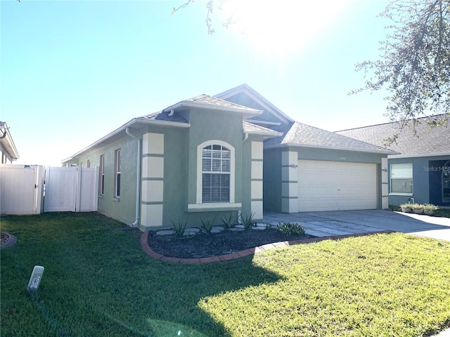 view of front of property with a garage and a front yard