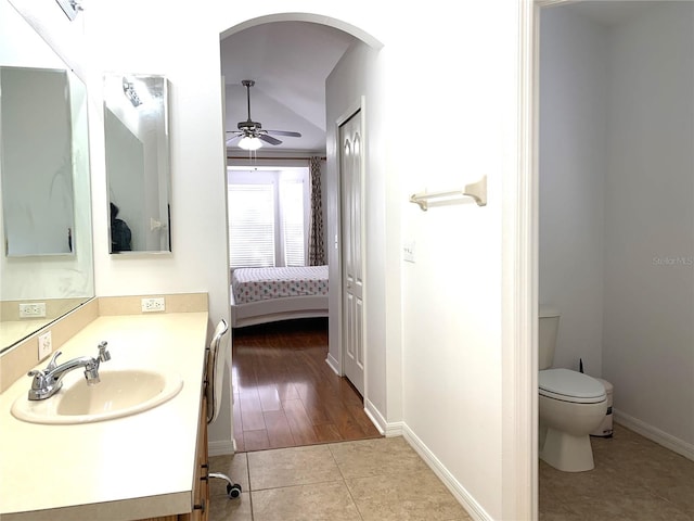 bathroom featuring tile patterned floors, ceiling fan, toilet, and vanity