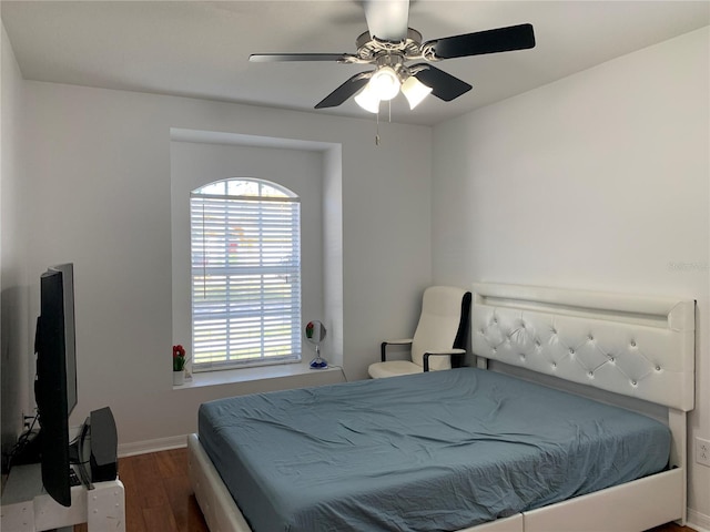 bedroom featuring ceiling fan and dark wood-type flooring