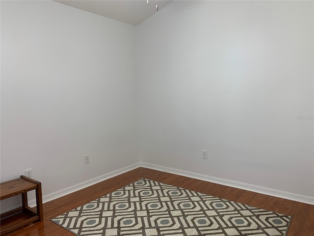 empty room with wood-type flooring