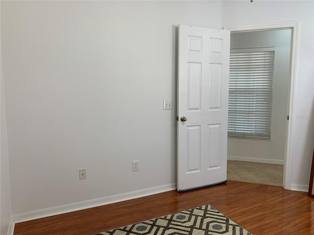 spare room featuring hardwood / wood-style flooring