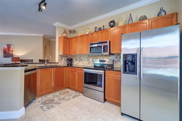 kitchen featuring appliances with stainless steel finishes, backsplash, crown molding, sink, and light tile patterned flooring