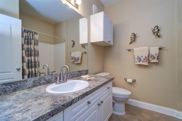 bathroom with toilet, vanity, tile patterned floors, and curtained shower