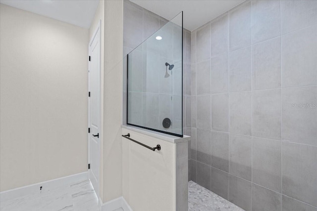 bathroom with tiled shower