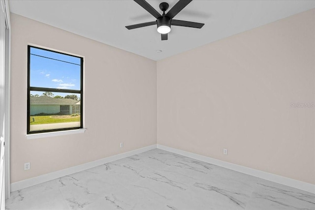 unfurnished room with ceiling fan