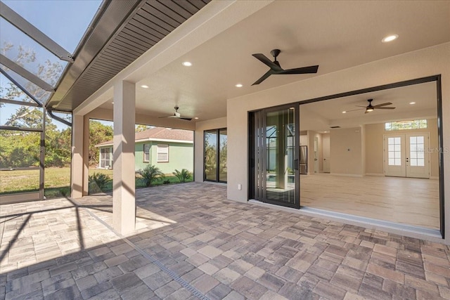 view of patio / terrace with glass enclosure and french doors