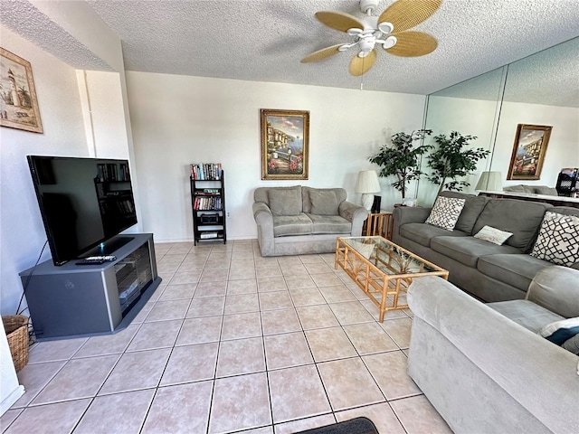 tiled living room with a textured ceiling and ceiling fan