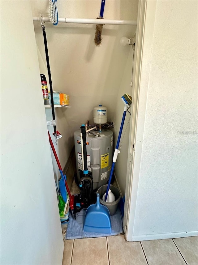 utility room featuring electric water heater