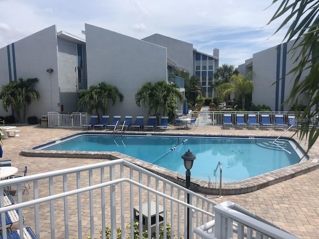 view of swimming pool with a patio area