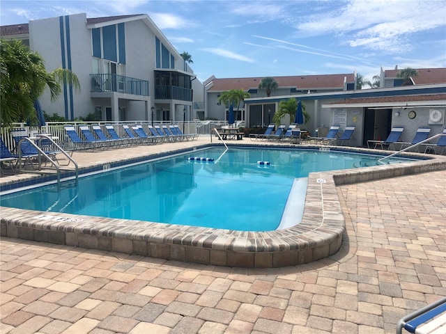 view of swimming pool with a patio