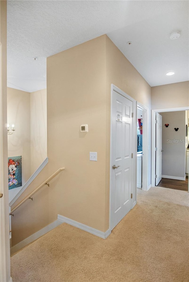 hallway featuring carpet